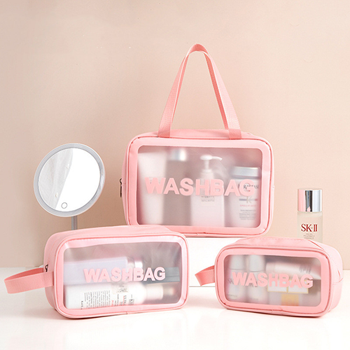 minimalist-pink-clear-makeup-pouch-organized-with-skincare-bottles-on-vanity minimalist-pink-clear-makeup-pouch-organized-with-skincare-bottles-on-vanity